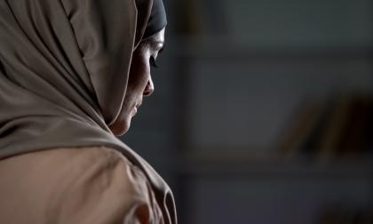Unhappy arab woman in hijab close-up, pessimistic mood, sorrow, melancholy