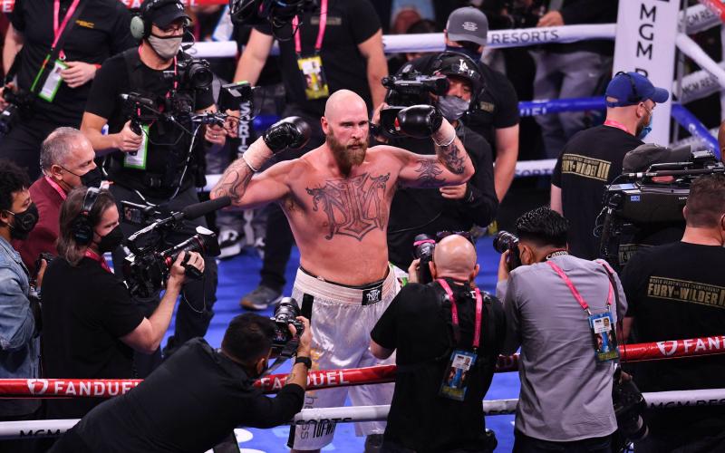 Finland's Robert "The Nordic Nightmare" Helenius celebrates his victory against Poland's Adam "Babyface" Kownacki (off frame) who was disqualified at round 6 for low blows during a 12-round featured rematch at the T-Mobile Arena in Las Vegas, Nevada, October 9, 2021. LEHTIKUVA / AFP, AFP / LEHTIKUVA / ROBYN BECK