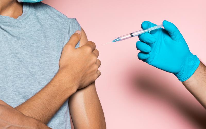 Young man refusing vaccine, anti vaccination concept