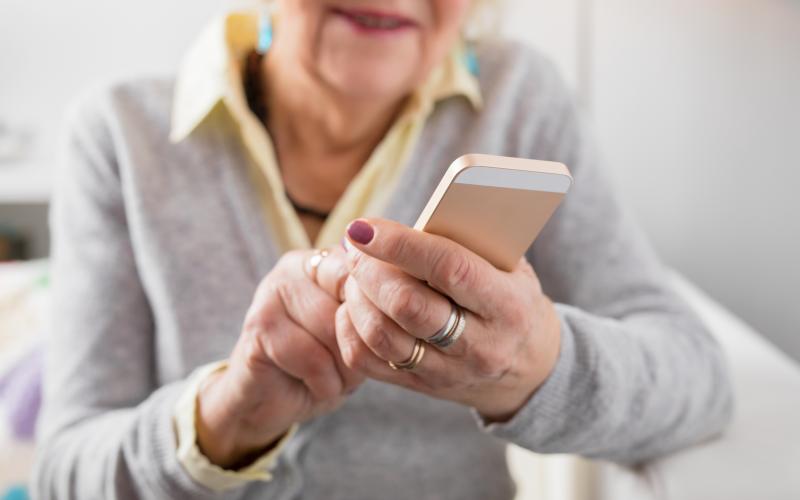 Senior woman holding smartphone