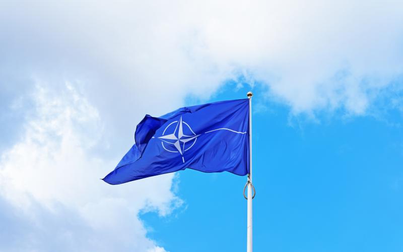 Vilnius, Lithuania - September 3, 2015: NATO flag waving by the wind